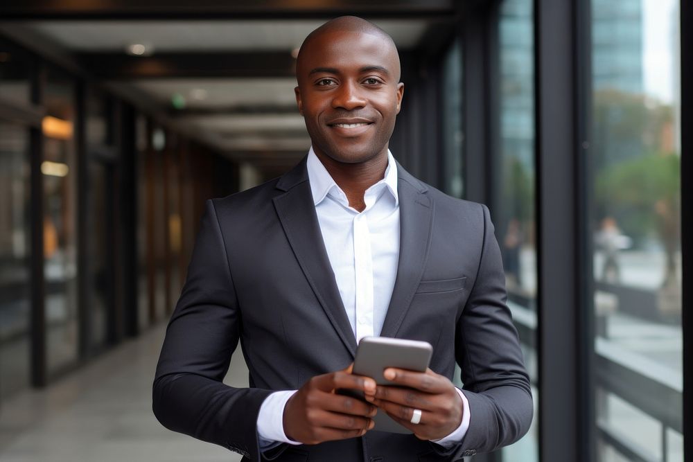 Black business man holding tablet blazer adult architecture. AI generated Image by rawpixel.