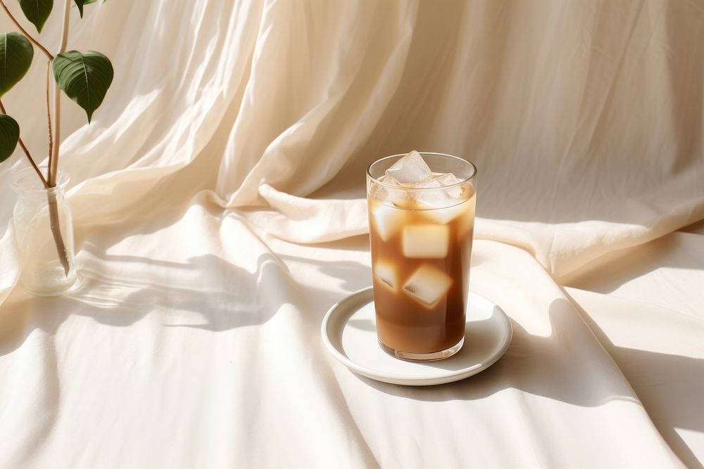 Iced coffee latte drink glass table. AI generated Image by rawpixel.