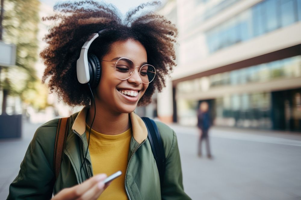 Smiling African female student in backpack looking at tablet headphones street adult. AI generated Image by rawpixel.