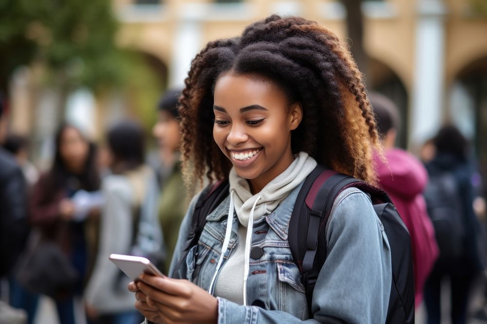 Smiling African female student in backpack looking at tablet street adult architecture. AI generated Image by rawpixel.