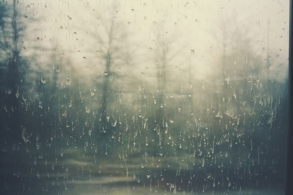 The inside of a window with a view of snow falling rain backgrounds outdoors. AI generated Image by rawpixel.
