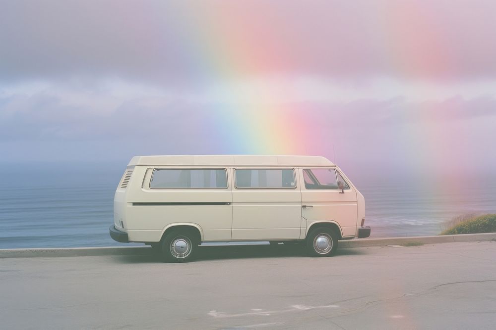 A van next to the ocean outdoors vehicle rainbow. AI generated Image by rawpixel.