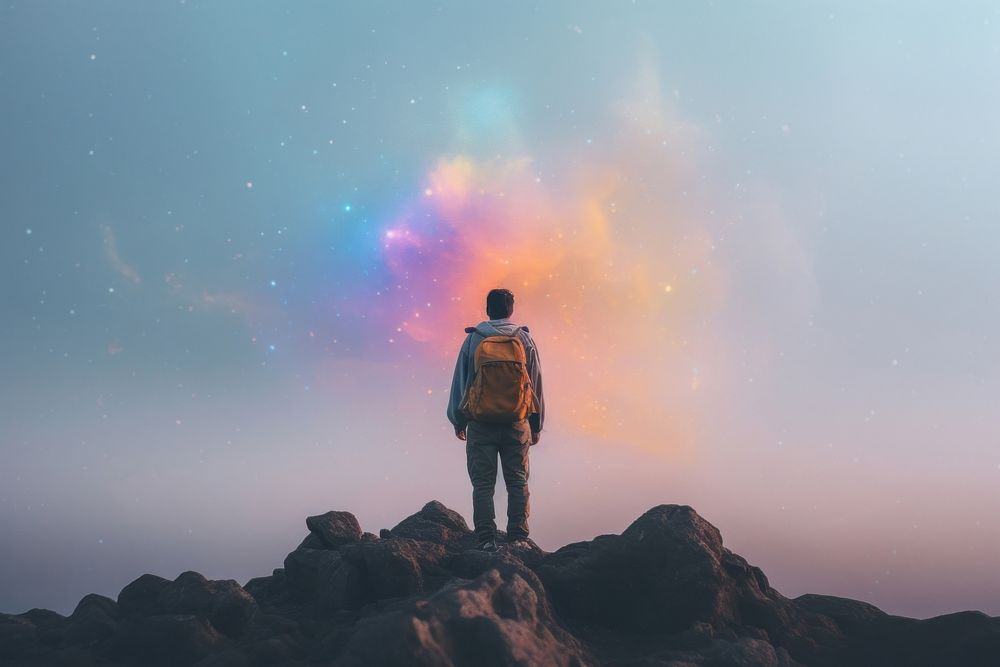 A backpack standing on top of a rock outdoors nature galaxy. AI generated Image by rawpixel.