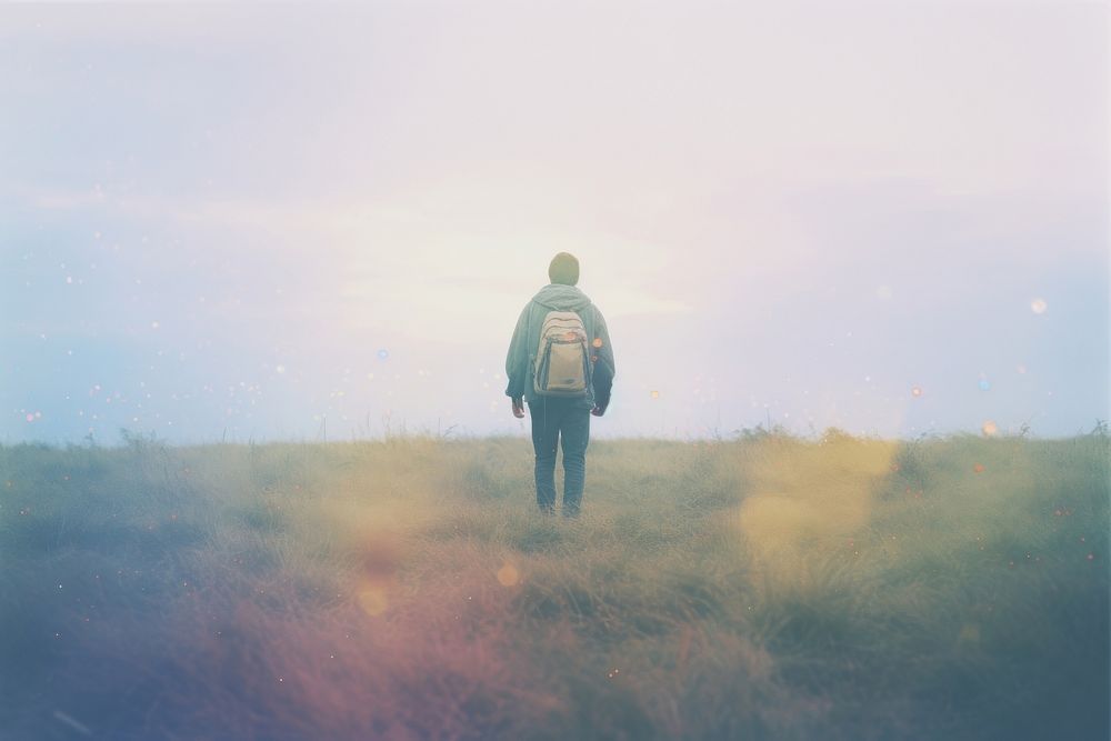 A couple backpack standing on top of a rock meadow outdoors walking nature. AI generated Image by rawpixel.