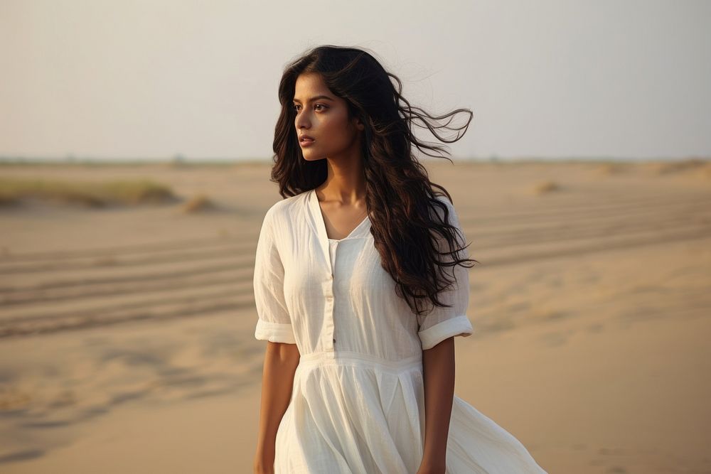 South asian woman in a white dress portrait desert adult. AI generated Image by rawpixel.