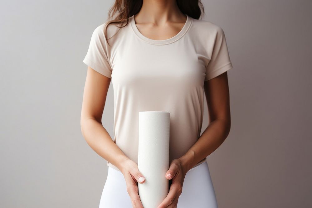 Happy woman wearing sportswear and holding yoga mat t-shirt sleeve blouse. AI generated Image by rawpixel.