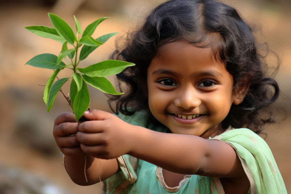 Bangladesh kid plant child happy. AI generated Image by rawpixel.
