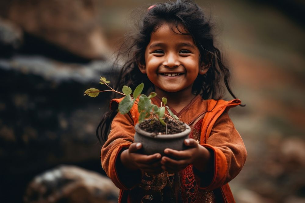 Bhutan kid plant smile child. AI generated Image by rawpixel.