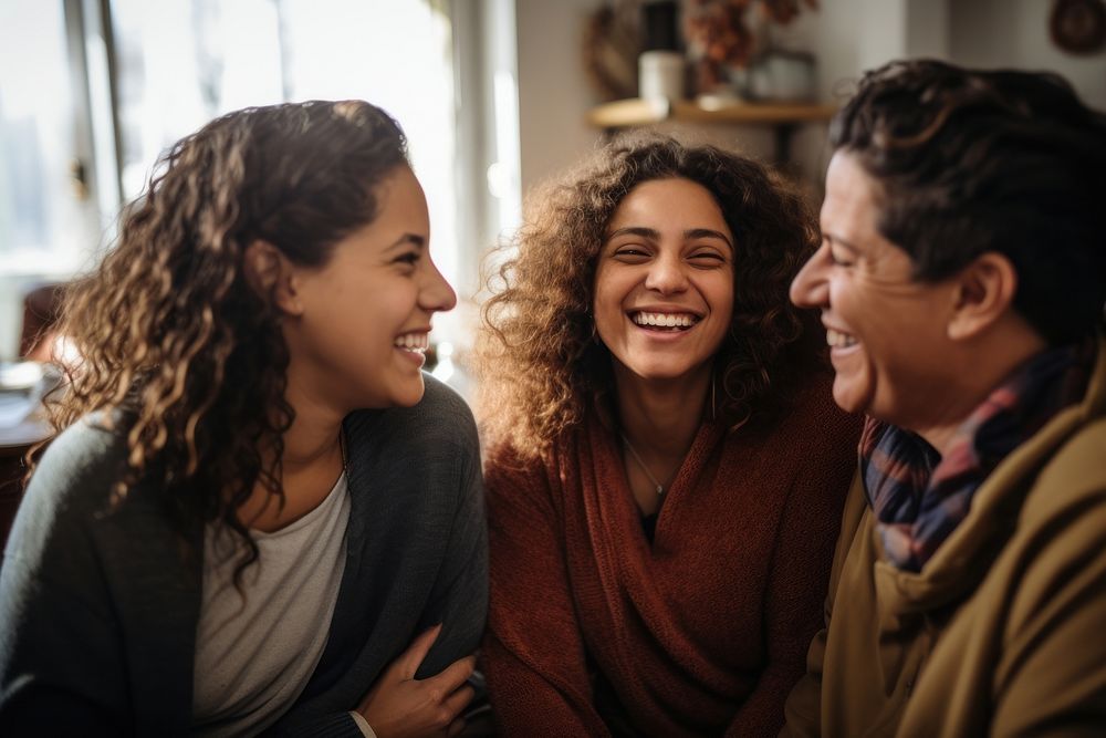 Latina LGBTQ family laughing talking smile. AI generated Image by rawpixel.