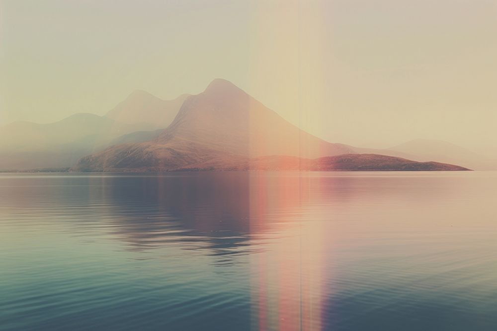 A lake with a mountain in the background landscape outdoors nature. AI generated Image by rawpixel.