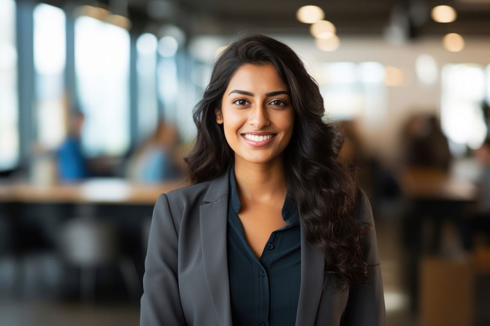Mixed south asian woman standing smiling office adult smile. AI generated Image by rawpixel.