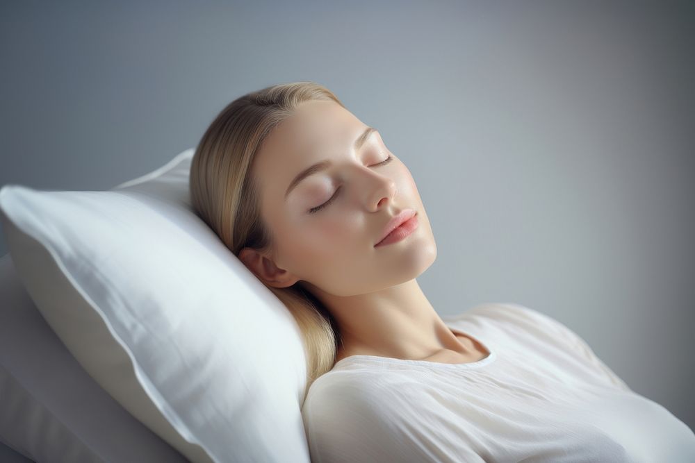 A person sleeping on a soft pillow comfortable adult face. AI generated Image by rawpixel.