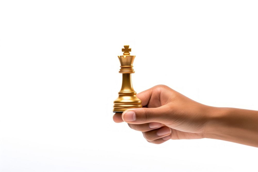 A gold chess piece game hand white background. AI generated Image by rawpixel.