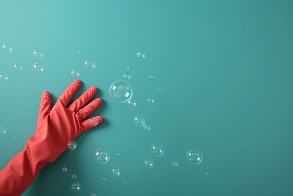 A hand wearing gloves bubble confetti clothing. AI generated Image by rawpixel.