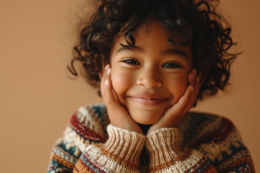 Mixed race kid in sweater smiling portrait smile happy. AI generated Image by rawpixel.