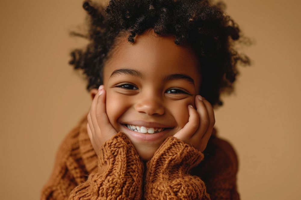 Mixed race kid in sweater smiling portrait child smile. AI generated Image by rawpixel.