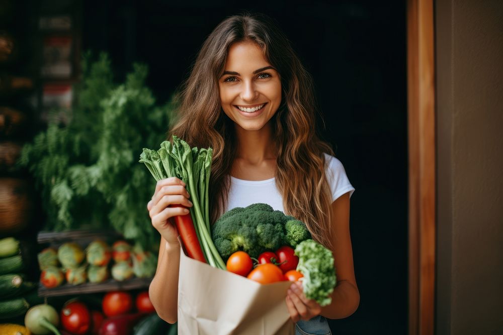 Woman hold paper bag vegetable smiling food. AI generated Image by rawpixel.