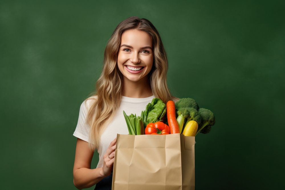Woman hold paper bag vegetable smiling smile. AI generated Image by rawpixel.