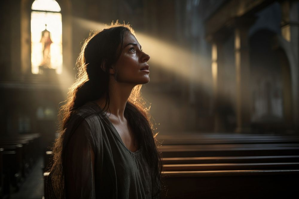 Hopeless woman talking to god in church portrait adult photo. AI generated Image by rawpixel.