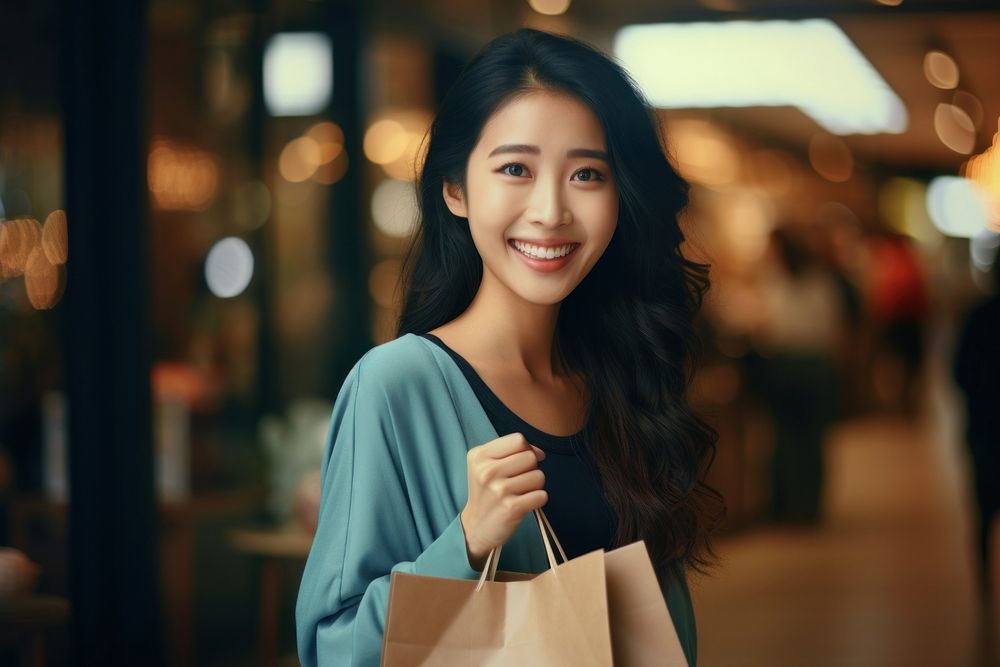 Woman holds shopping bag portrait smiling looking. AI generated Image by rawpixel.
