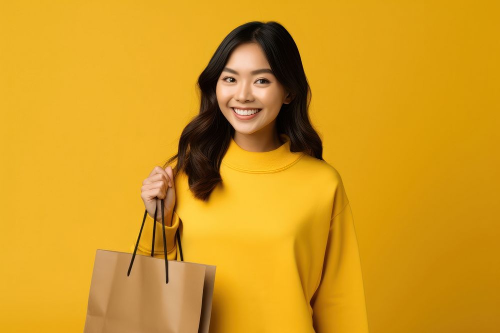 Woman holds shopping bag standing portrait handbag. AI generated Image by rawpixel.