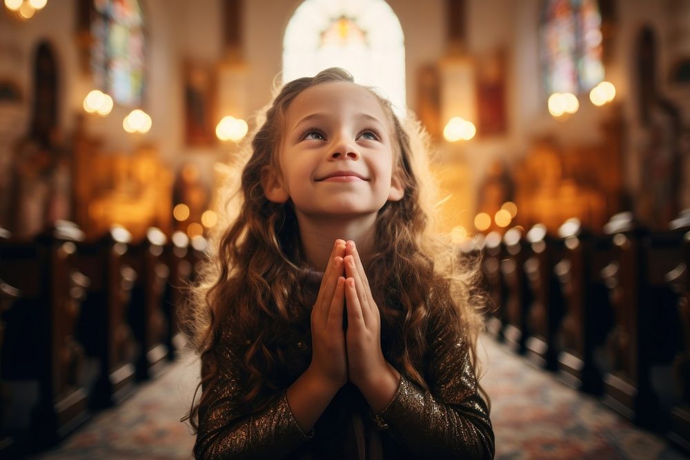 Happy woman praying in church for God worship child spirituality. AI generated Image by rawpixel.