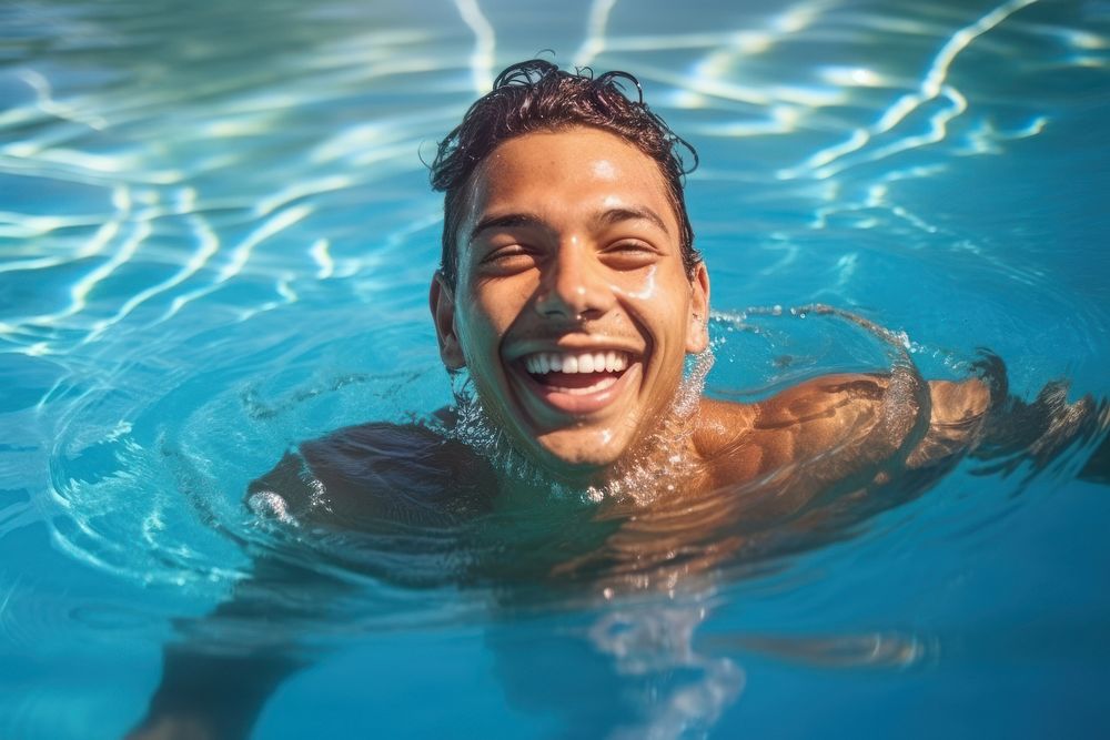 Hispanic Peruvian swimming in a pool recreation laughing smiling. AI generated Image by rawpixel.