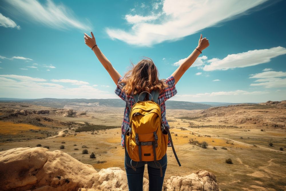 A traveler raising arm backpack landscape day. AI generated Image by rawpixel.
