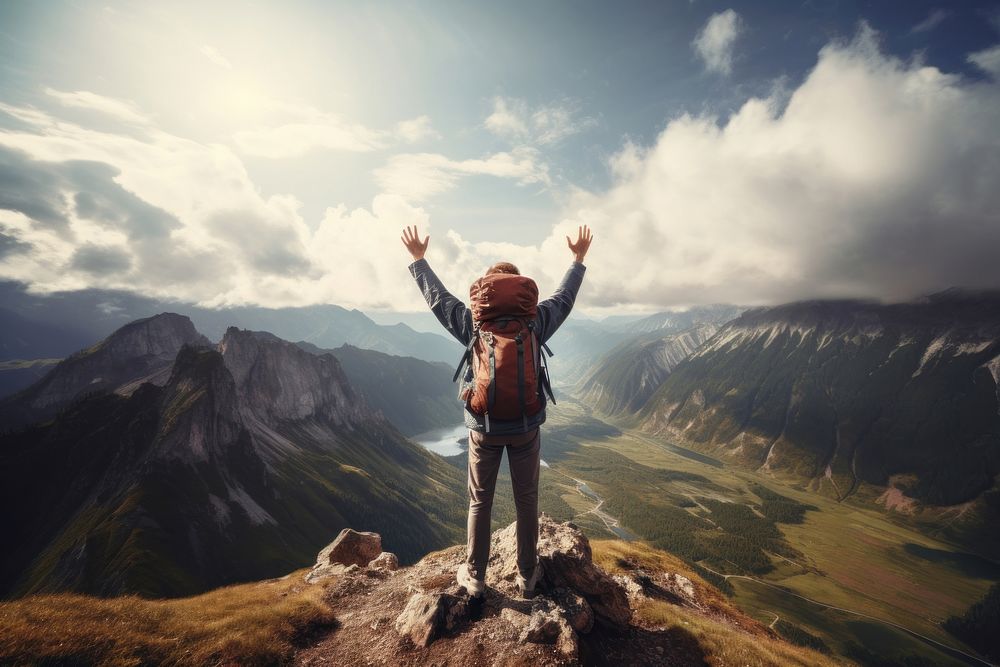 A traveler raising arm backpack adventure landscape. AI generated Image by rawpixel.
