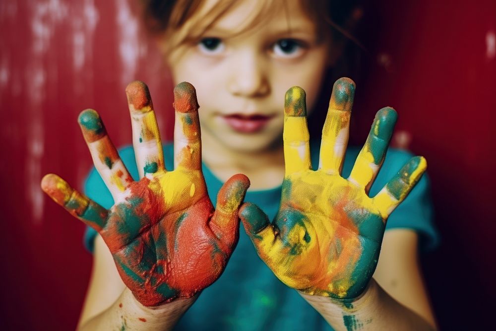 A kid painting hand toddler finger. AI generated Image by rawpixel.