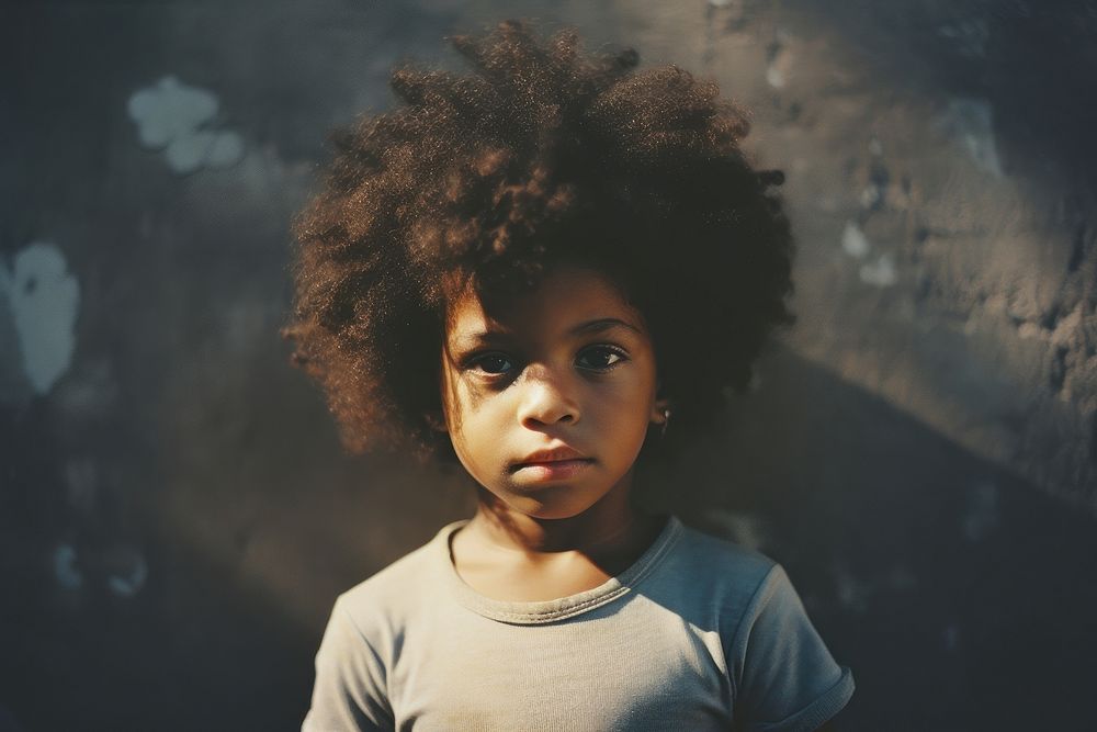 A little black kid photography portrait child. AI generated Image by rawpixel.