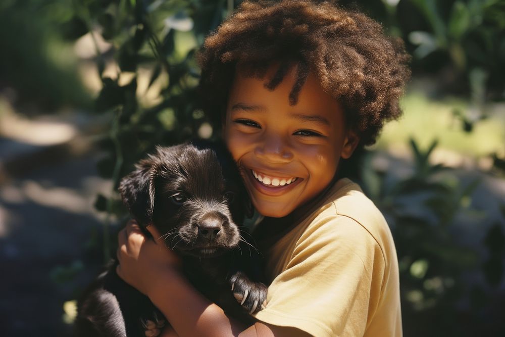 A little black kid hug a puppy dog pet photography. AI generated Image by rawpixel.