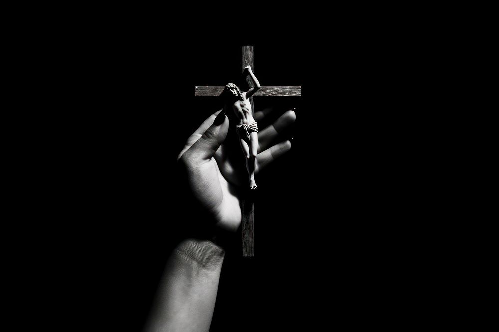 A hand holding a cross crucifix finger symbol. AI generated Image by rawpixel.