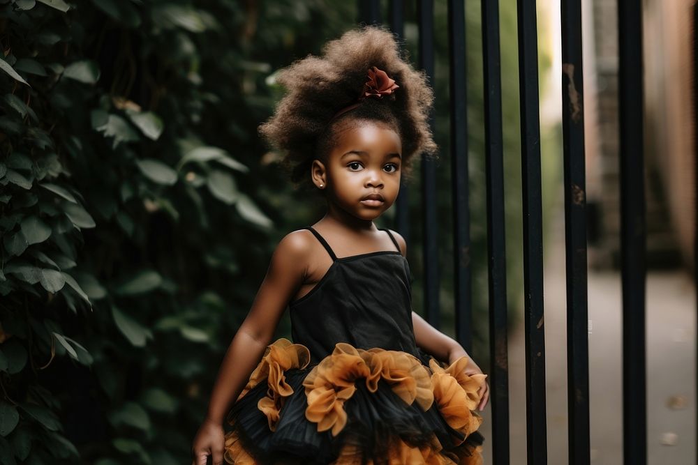 A little black girl wearing beign color dress child baby cute. AI generated Image by rawpixel.