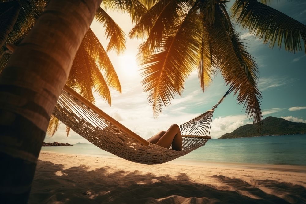 A man sleeping in a hammock under the coconut tree on the beach outdoors vacation sea. AI generated Image by rawpixel.