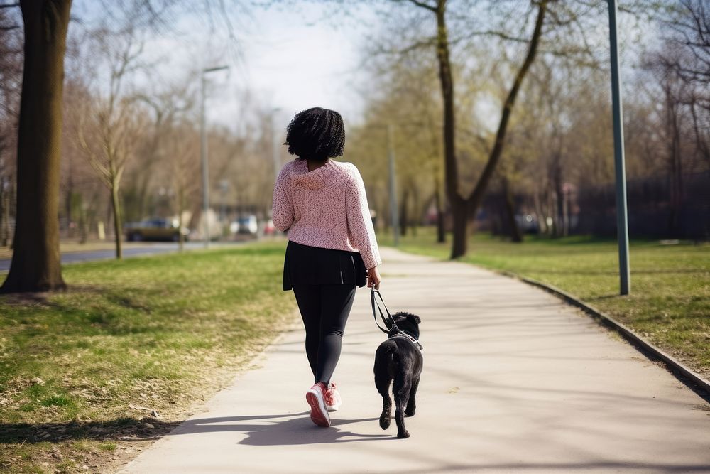 Black woman walking their dog pet outdoors running. AI generated Image by rawpixel.
