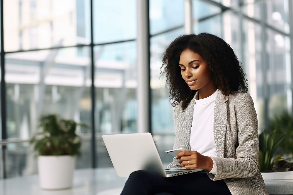 Black business young woman laptop computer sitting. AI generated Image by rawpixel.