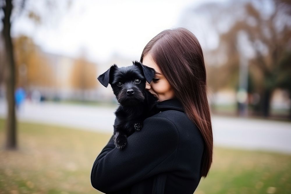 Black hugging with dog pet portrait outdoors. AI generated Image by rawpixel.