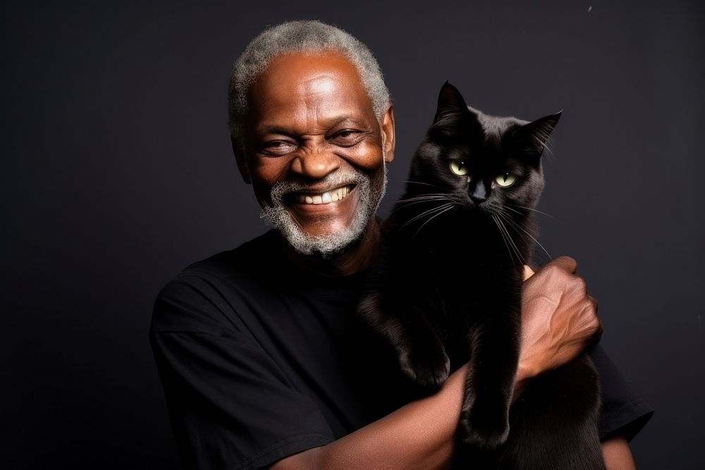 Black old man with cat pet portrait smiling. AI generated Image by rawpixel.