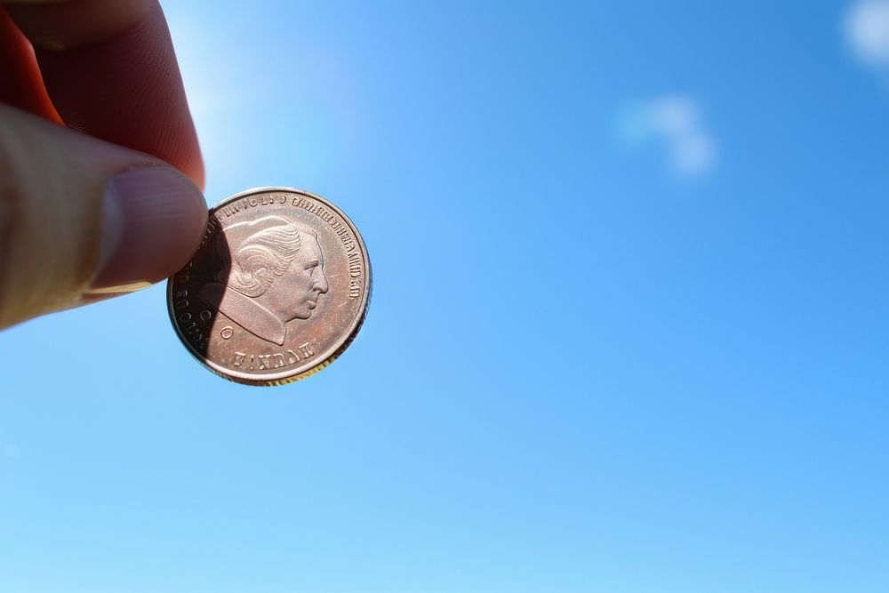 Coin money blue sky. AI generated Image by rawpixel.