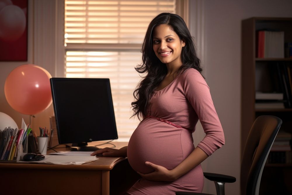 Pregnant business woman furniture computer portrait. 