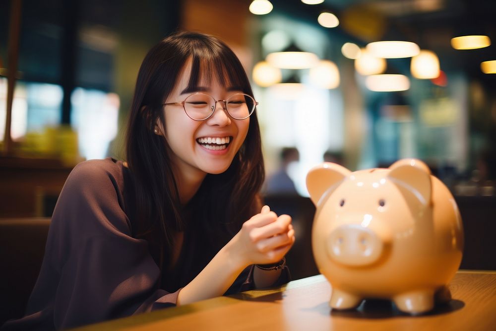 Piggy bank smiling adult smile. AI generated Image by rawpixel.