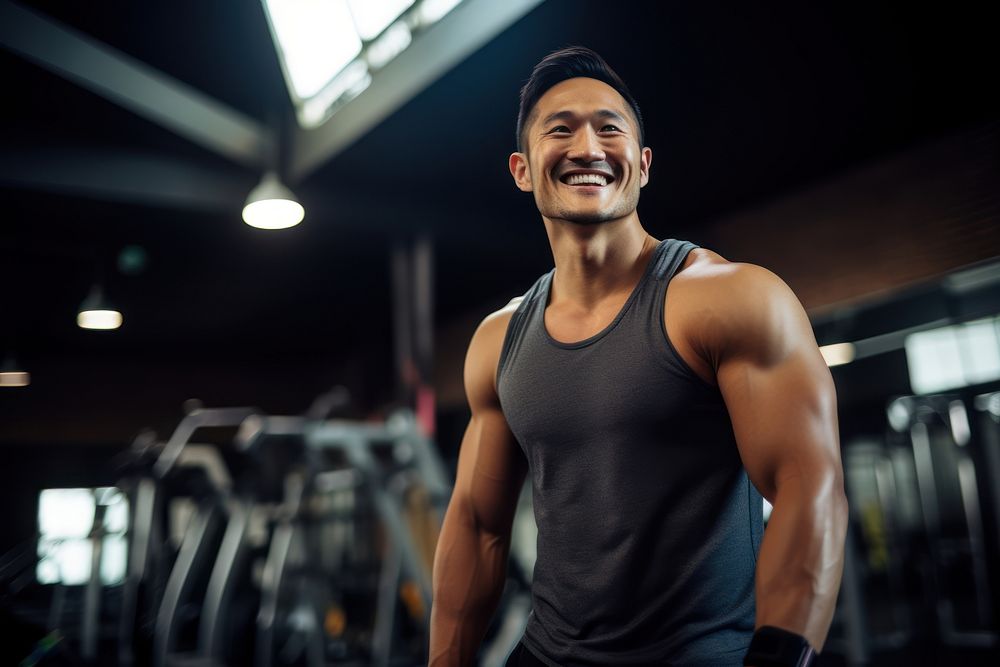 Asian man in sportswear walking in a gym smiling adult determination. AI generated Image by rawpixel.