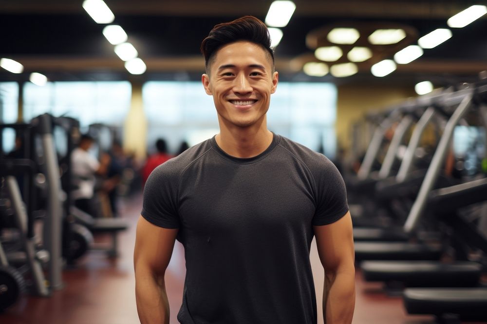 Asian man in sportswear walking in a gym smiling fitness adult. AI generated Image by rawpixel.