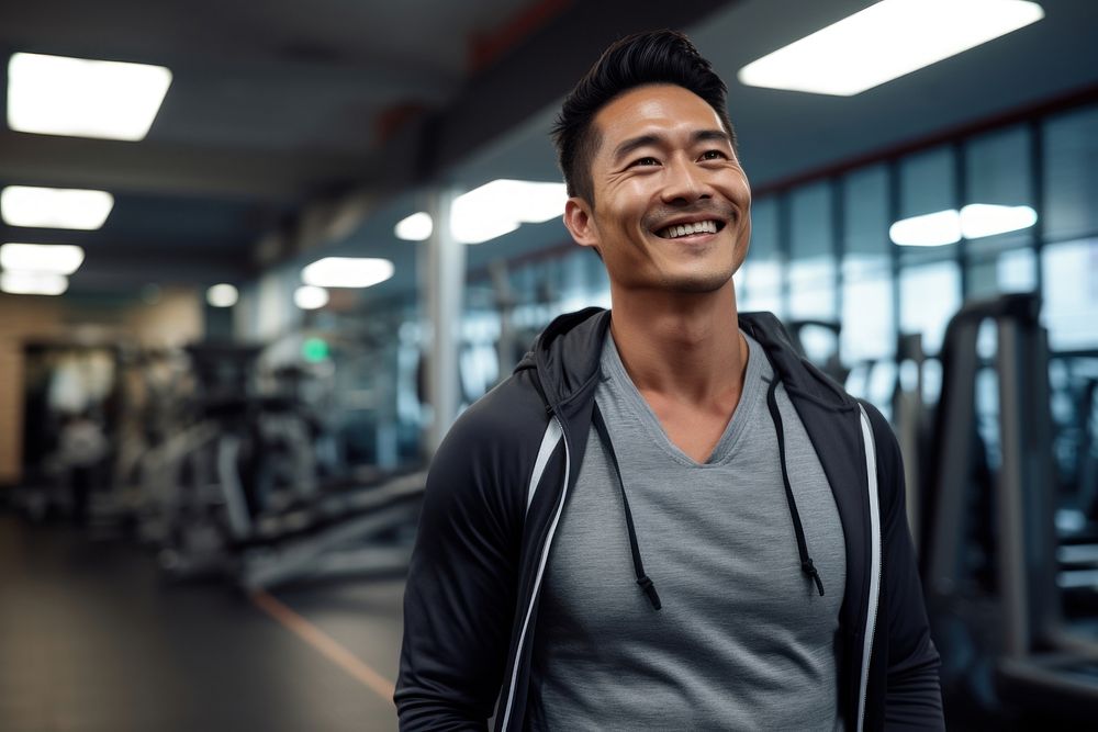 Asian man in sportswear walking in a gym smiling smile adult. AI generated Image by rawpixel.