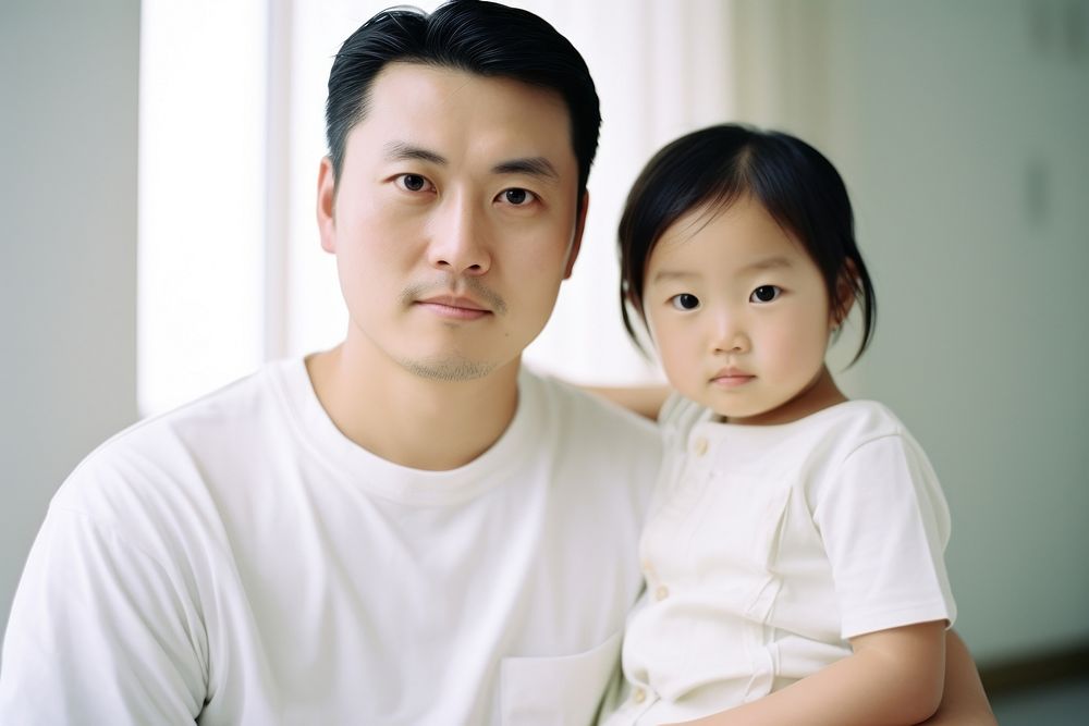 Asian family child portrait sitting. AI generated Image by rawpixel.