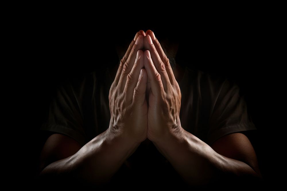 Praying hands praying black black background. AI generated Image by rawpixel.
