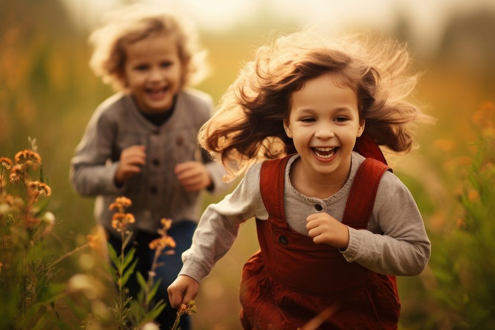 Smiling children outdoors carefree laughing. AI generated Image by rawpixel.