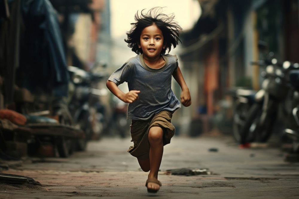 Thai kid street city running. AI generated Image by rawpixel.