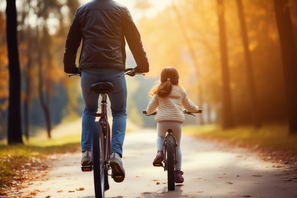 Dad helping his daughter ride a bike bicycle vehicle cycling. AI generated Image by rawpixel.